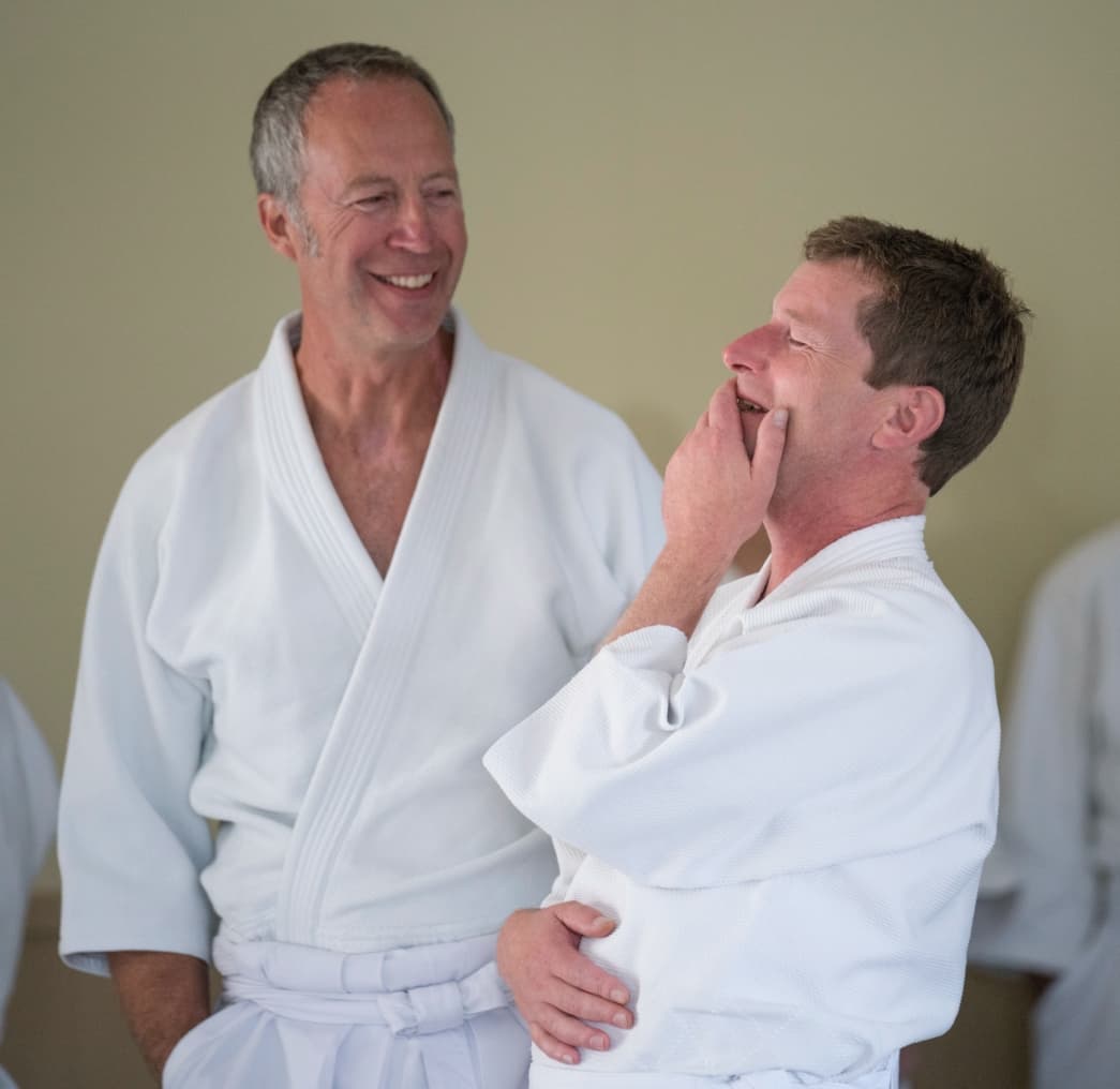 The headquarters dojo interior — a large, bright training space with wooden floors