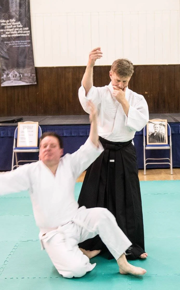 Demonstrating how to release the partner's grip